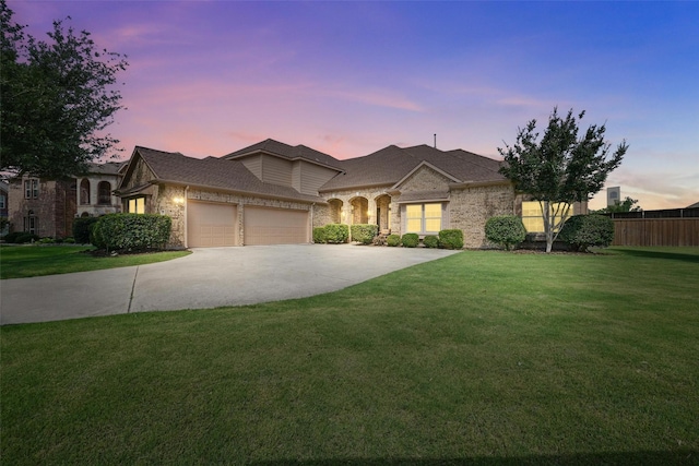 14708 Myrtle Beach Ln, Frisco, TX 75035 - french country home with stone siding, an attached garage, and driveway