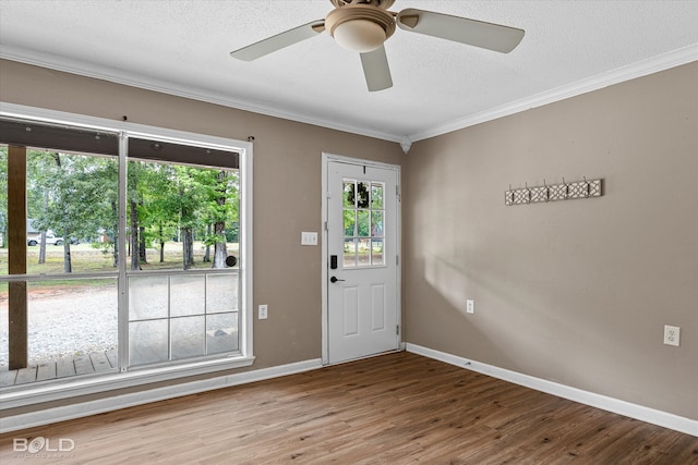 4382 Circle Square Dr, Mooringsport, LA 71060 - foyer entrance featuring wood finished floors, ornamental molding, baseboards, a ceiling fan, and a textured ceiling
