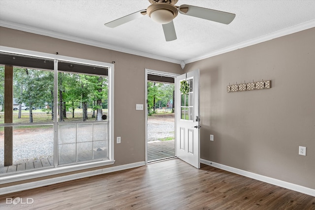 4382 Circle Square Dr, Mooringsport, LA 71060 - foyer featuring a textured ceiling, baseboards, wood finished floors, ornamental molding, and ceiling fan