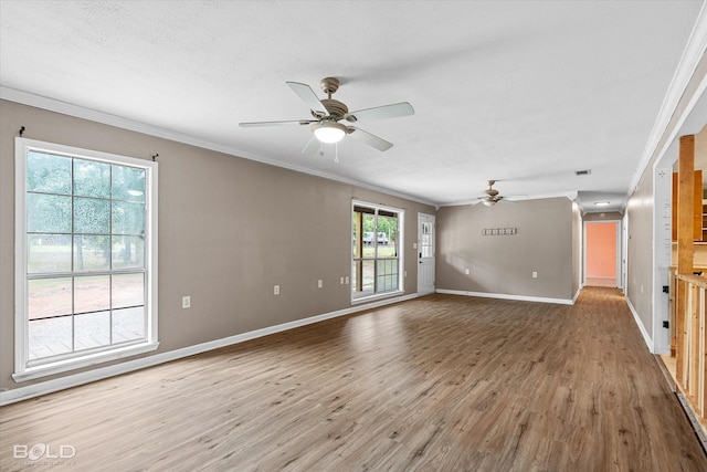 4382 Circle Square Dr, Mooringsport, LA 71060 - unfurnished living room featuring a ceiling fan, crown molding, wood finished floors, and baseboards