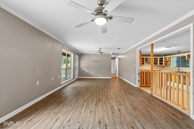 4382 Circle Square Dr, Mooringsport, LA 71060 - unfurnished living room with ornamental molding, ceiling fan, wood finished floors, and baseboards