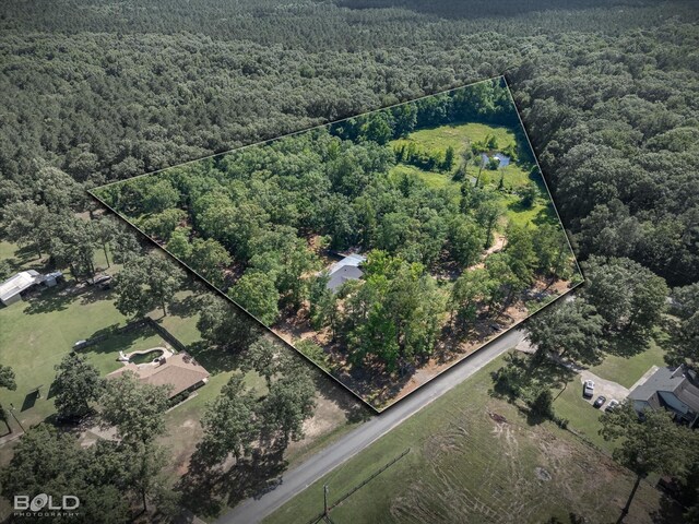 4382 Circle Square Dr, Mooringsport, LA 71060 - aerial view of property and surrounding area with a heavily wooded area and property parcel outlined