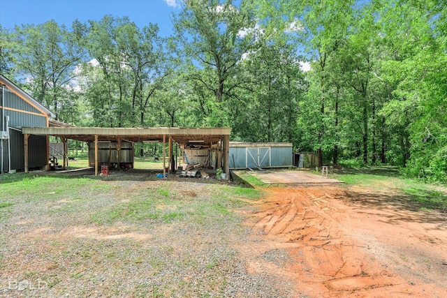 4382 Circle Square Dr, Mooringsport, LA 71060 - view of yard with an outbuilding, a detached carport, and a pole building