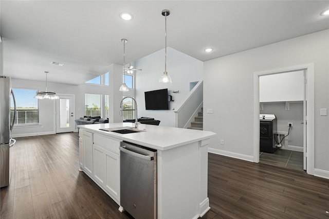 6133 Poolside Way, Royse City, TX 75189 - kitchen featuring stainless steel appliances, a sink, baseboards, open floor plan, and white cabinets