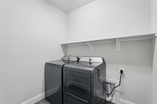 6133 Poolside Way, Royse City, TX 75189 - washroom with baseboards and washing machine and clothes dryer