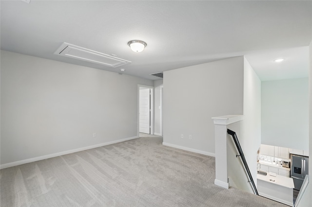 6133 Poolside Way, Royse City, TX 75189 - unfurnished room with attic access, light carpet, and baseboards