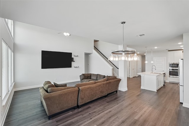 6133 Poolside Way, Royse City, TX 75189 - living room with dark wood-style floors, stairs, baseboards, and recessed lighting