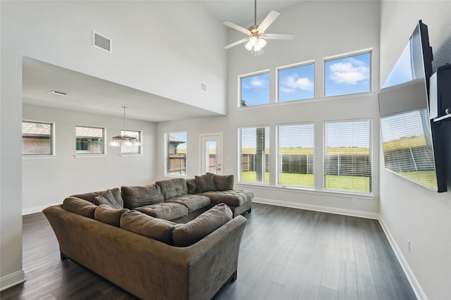 6133 Poolside Way, Royse City, TX 75189 - living room with baseboards, a towering ceiling, dark wood finished floors, ceiling fan, and plenty of natural light