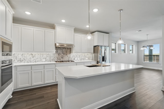 6133 Poolside Way, Royse City, TX 75189 - kitchen featuring appliances with stainless steel finishes, dark wood-type flooring, a sink, light countertops, and under cabinet range hood