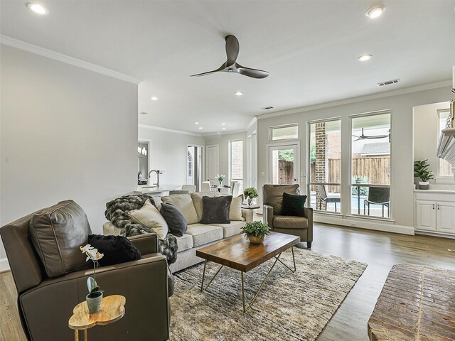 4033 Oakhaven Dr, Plano, TX 75093 - living area with ceiling fan, ornamental molding, wood finished floors, recessed lighting, and baseboards
