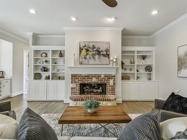 4033 Oakhaven Dr, Plano, TX 75093 - living room with ornamental molding, light wood-type flooring, recessed lighting, a fireplace, and a ceiling fan