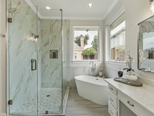 4033 Oakhaven Dr, Plano, TX 75093 - bathroom with ornamental molding, a soaking tub, vanity, a marble finish shower, and recessed lighting