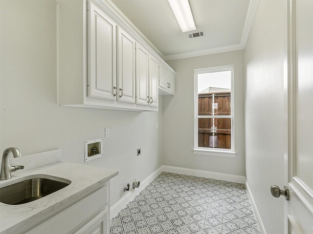 4033 Oakhaven Dr, Plano, TX 75093 - laundry room with electric dryer hookup, washer hookup, gas dryer hookup, cabinet space, and ornamental molding