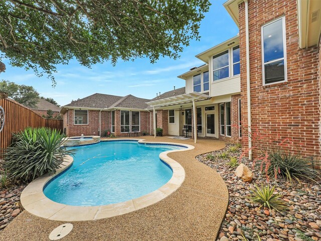 4033 Oakhaven Dr, Plano, TX 75093 - view of swimming pool with a pergola, a pool with connected hot tub, and a patio