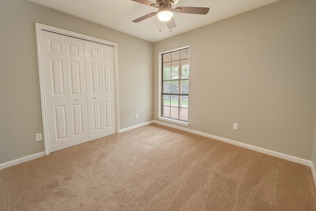 3825 Hackberry Ln, Bedford, TX 76021 - unfurnished bedroom with carpet floors, baseboards, a closet, and ceiling fan