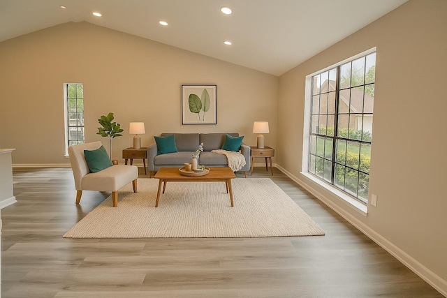 3825 Hackberry Ln, Bedford, TX 76021 - living room featuring recessed lighting, lofted ceiling, plenty of natural light, baseboards, and wood finished floors