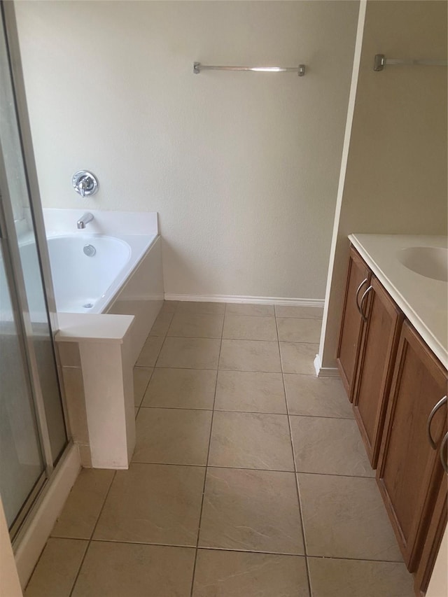 1106 Mule Deer Dr, Arlington, TX 76002 - full bath with vanity, tile patterned flooring, a stall shower, and baseboards