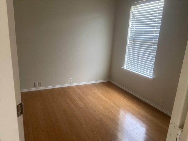 1106 Mule Deer Dr, Arlington, TX 76002 - empty room with wood finished floors and baseboards