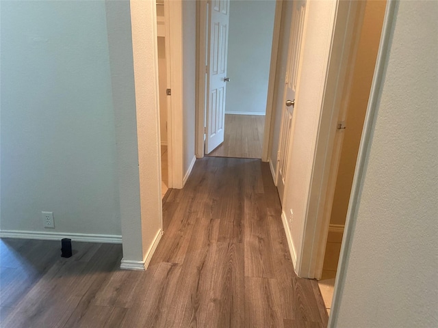 1106 Mule Deer Dr, Arlington, TX 76002 - hall featuring wood finished floors, baseboards, and a textured wall