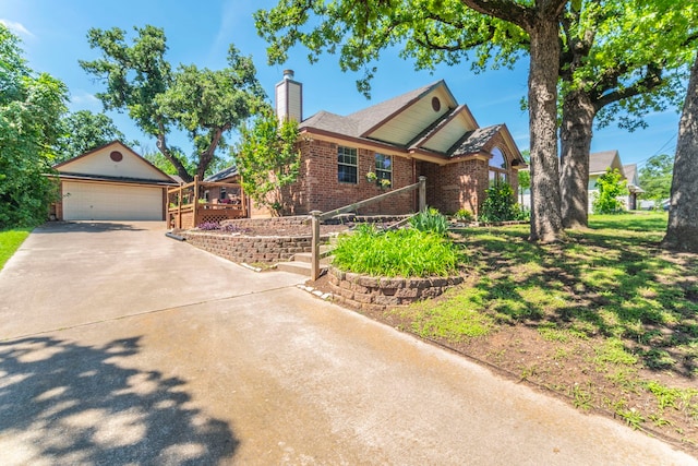 809 W Ball St, Weatherford, TX 76086 - view of front of home featuring an outbuilding, a chimney, and brick siding