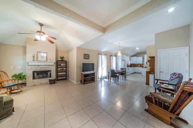 809 W Ball St, Weatherford, TX 76086 - living room with vaulted ceiling, light tile patterned flooring, a ceiling fan, a stone fireplace, and baseboards