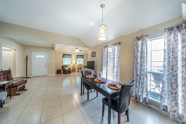 809 W Ball St, Weatherford, TX 76086 - dining room with plenty of natural light, lofted ceiling, light tile patterned floors, and baseboards