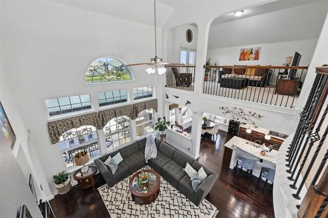505 Kappa Way, Mckinney, TX 75071 - living room featuring a towering ceiling, ceiling fan, hardwood / wood-style flooring, and arched walkways