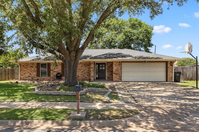 4814 Rhea Rd, Wichita Falls, TX 76308 - ranch-style home featuring an attached garage, concrete driveway, and brick siding