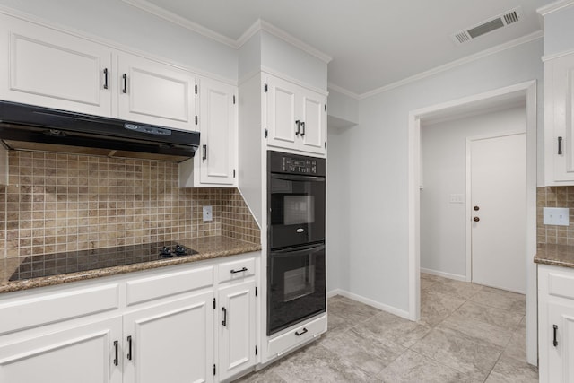 4814 Rhea Rd, Wichita Falls, TX 76308 - kitchen featuring under cabinet range hood, black appliances, decorative backsplash, white cabinets, and stone counters