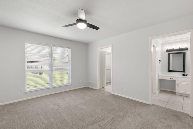 4814 Rhea Rd, Wichita Falls, TX 76308 - unfurnished bedroom with light colored carpet, ensuite bath, baseboards, and an office area