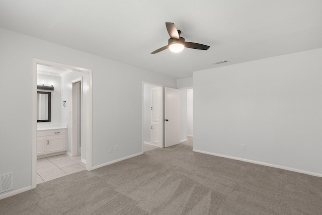 4814 Rhea Rd, Wichita Falls, TX 76308 - unfurnished bedroom featuring light colored carpet, baseboards, connected bathroom, and a ceiling fan