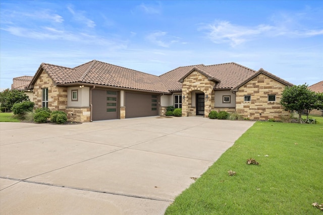 1209 Catalina Bay Blvd, Granbury, TX 76048 - view of front facade featuring stone siding, a tile roof, an attached garage, concrete driveway, and a front yard