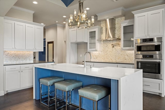 1209 Catalina Bay Blvd, Granbury, TX 76048 - kitchen featuring wall chimney exhaust hood, double oven, ornamental molding, recessed lighting, and tasteful backsplash