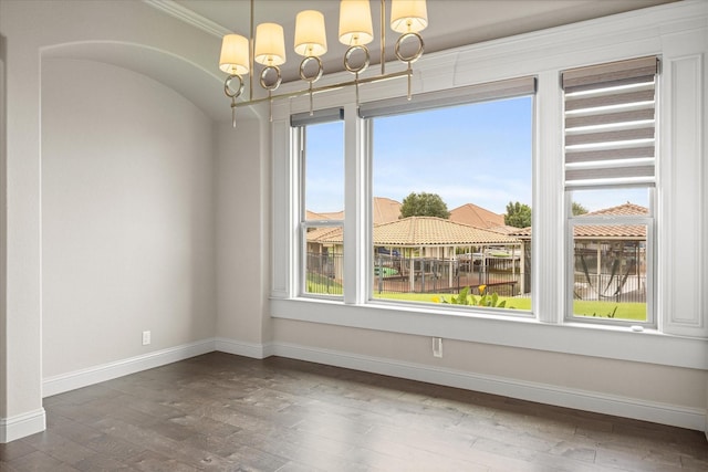 1209 Catalina Bay Blvd, Granbury, TX 76048 - unfurnished dining area featuring wood finished floors, a chandelier, plenty of natural light, baseboards, and crown molding