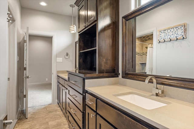 1209 Catalina Bay Blvd, Granbury, TX 76048 - bathroom with double vanity, recessed lighting, a shower with curtain, and wood finished floors