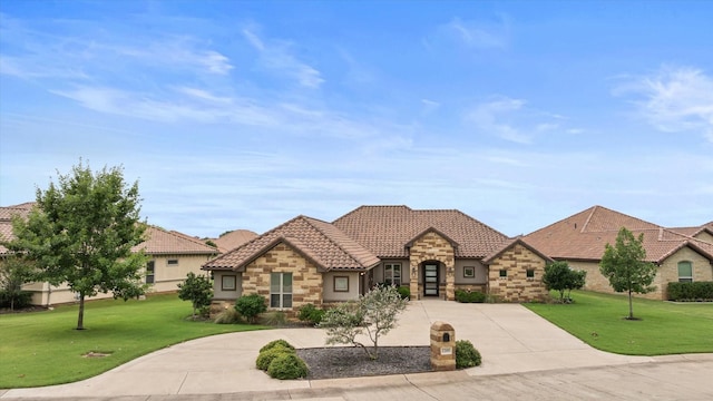 1209 Catalina Bay Blvd, Granbury, TX 76048 - view of front of home with stone siding, a front yard, curved driveway, and a tiled roof