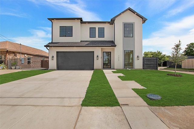 1903 Mcbroom St, Dallas, TX 75212 - view of front of home featuring stucco siding, concrete driveway, and an attached garage