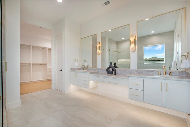 1903 Mcbroom St, Dallas, TX 75212 - full bath with a shower stall, double vanity, and a walk in closet