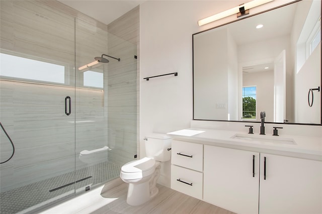 1903 Mcbroom St, Dallas, TX 75212 - bathroom with toilet, vanity, a stall shower, and recessed lighting