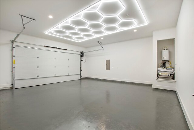 1903 Mcbroom St, Dallas, TX 75212 - garage with baseboards, tankless water heater, electric panel, and recessed lighting
