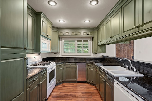 400 Titus St, Mckinney, TX 75069 - kitchen featuring green cabinetry, white appliances, a sink, dark wood-style flooring, and recessed lighting