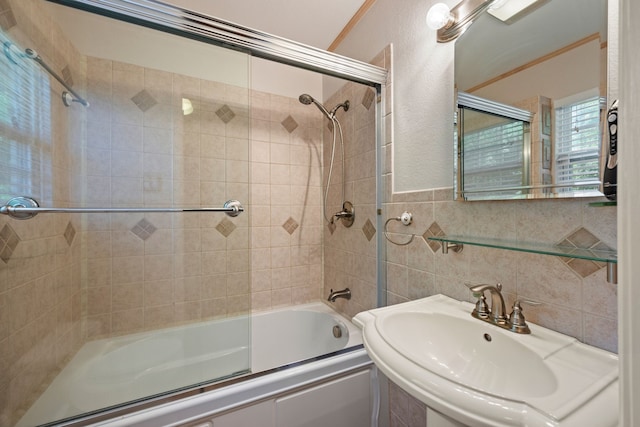 400 Titus St, Mckinney, TX 75069 - full bathroom featuring a sink, shower / bath combination with glass door, and tile walls