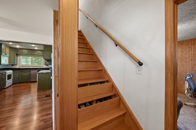 400 Titus St, Mckinney, TX 75069 - stairway with wood finished floors and a textured ceiling