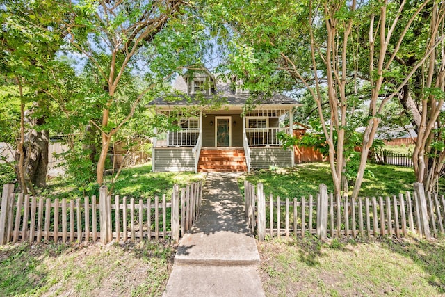 400 Titus St, Mckinney, TX 75069 - view of front of home with a porch, a fenced front yard, and stairway