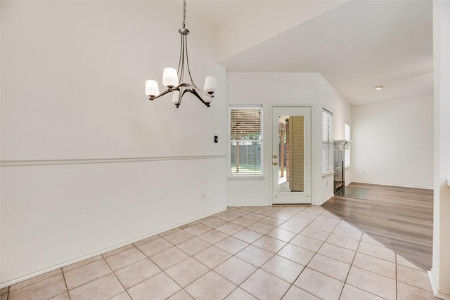 1213 Sonoma Dr, Allen, TX 75013 - spare room with a chandelier and light tile patterned floors