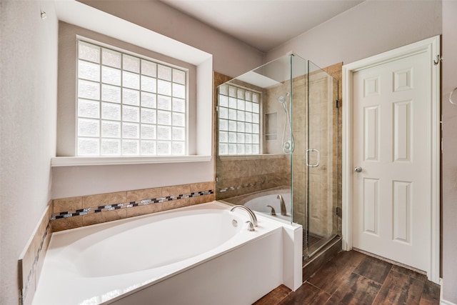 1213 Sonoma Dr, Allen, TX 75013 - bathroom featuring a bath, healthy amount of natural light, a stall shower, and wood finished floors