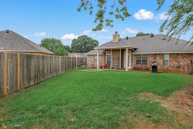 6204 E Oxbow, Bossier City, LA 71112 - back of house featuring brick siding, a chimney, and a shingled roof
