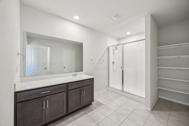 913 Alton Dr, Aubrey, TX 76227 - bathroom with a shower stall, vanity, tile patterned flooring, and recessed lighting