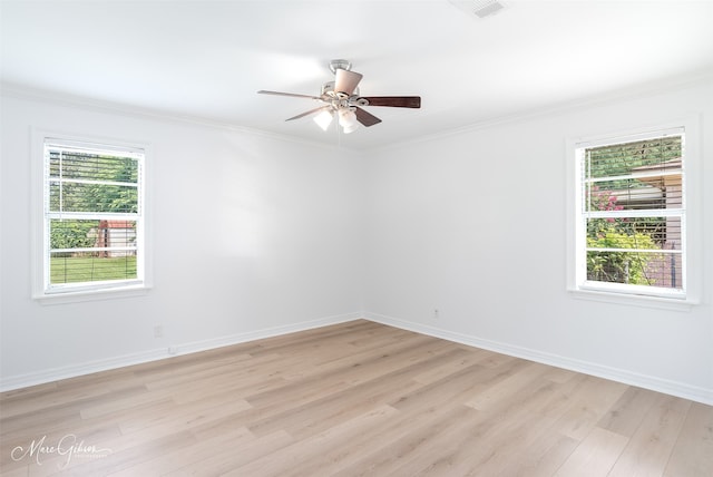 5710 Grover Pl, Shreveport, LA 71105 - unfurnished room featuring light wood finished floors, a ceiling fan, crown molding, and baseboards