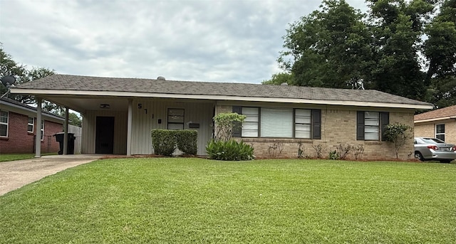 5710 Grover Pl, Shreveport, LA 71105 - ranch-style house with concrete driveway, a front lawn, a carport, board and batten siding, and brick siding